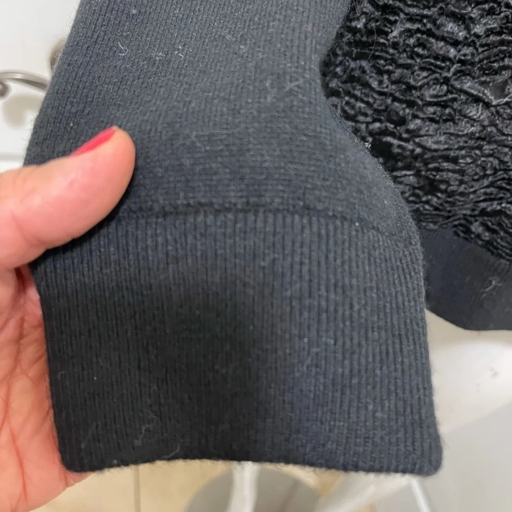 Kate spade black sweater. Looks like Front made with the unique sheep fur.